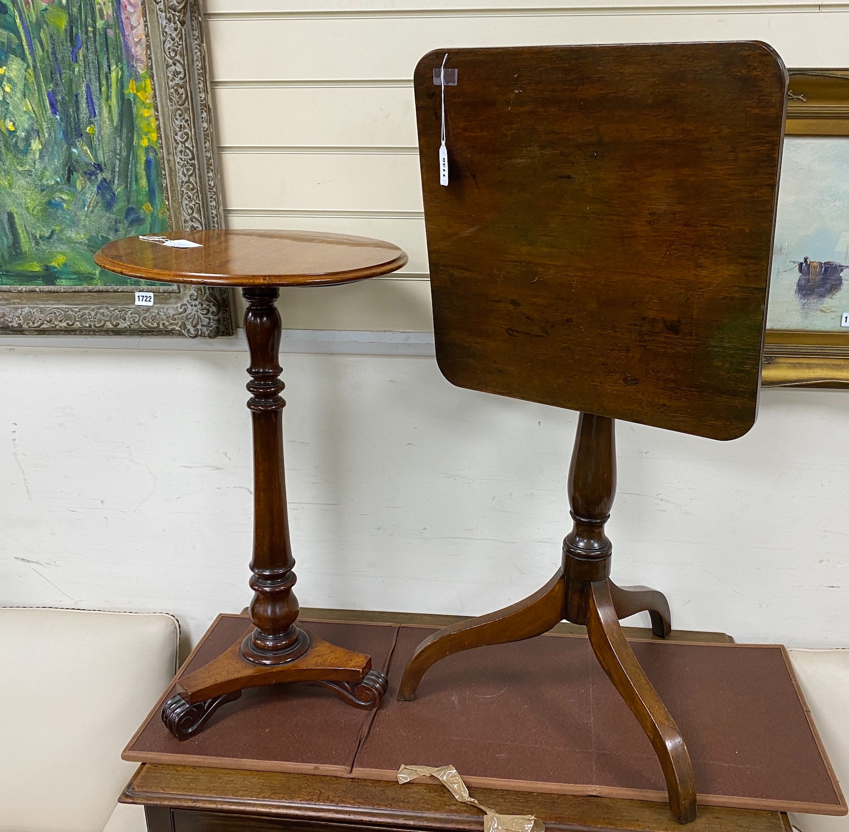 An early 19th century mahogany tilt top tripod wine table and a Victorian circular wine table, larger width 47cm, height 61cm